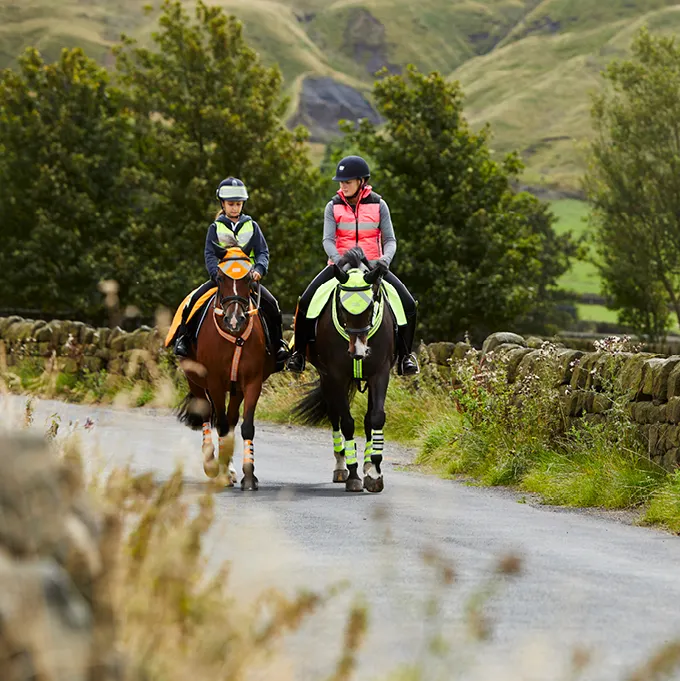 two horse riders on hack