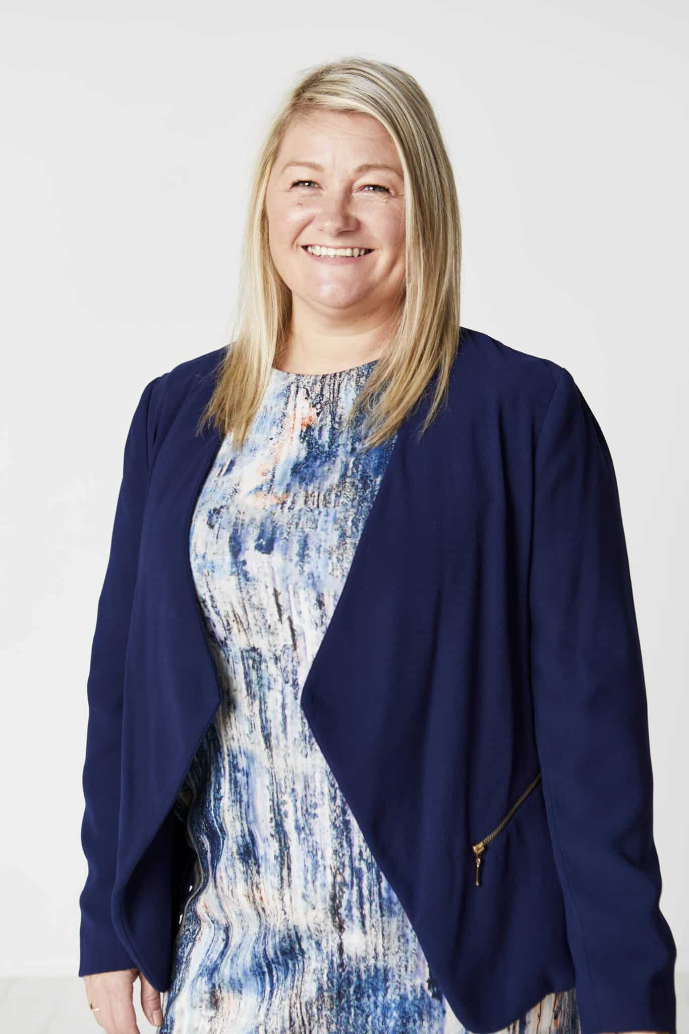 Lisa, Head of Customer Services at Harry Hall One Club, smiling and representing the brand